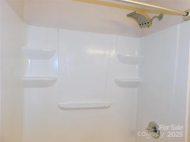 a close view of a shower in the bathroom