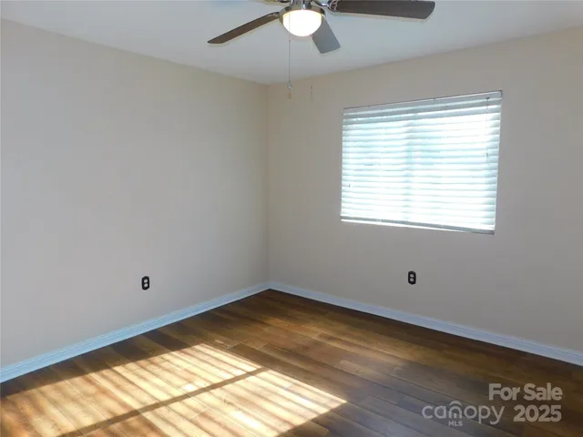 a room with window and wooden floor