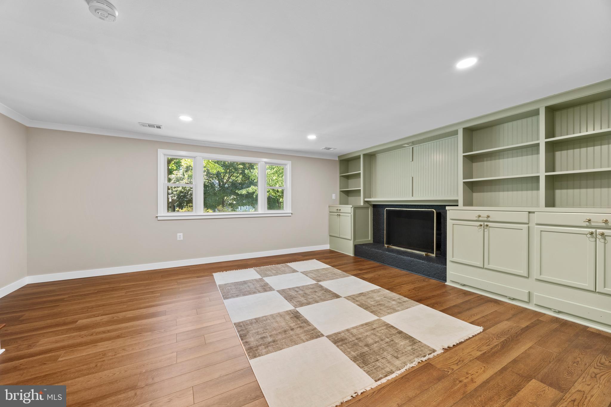 11019 Ring Road Reston, VA 20190 - Photo 57 of 78 a view of an empty room with a fireplace and a window