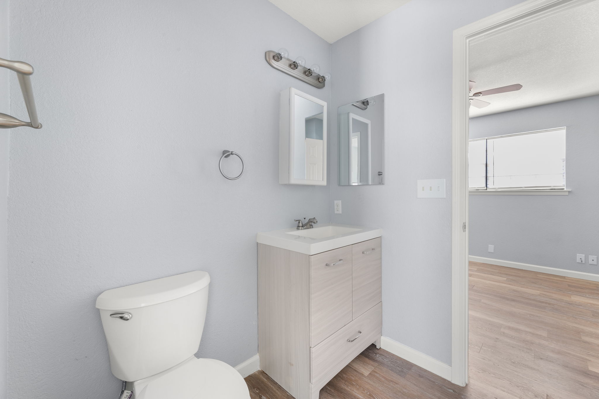 3802 Foust Trail, Unit A Georgetown, TX 78628 - Photo 26 of 34 A well-appointed bathroom with light-toned cabinetry and practical fixtures, creating a clean aesthetic.