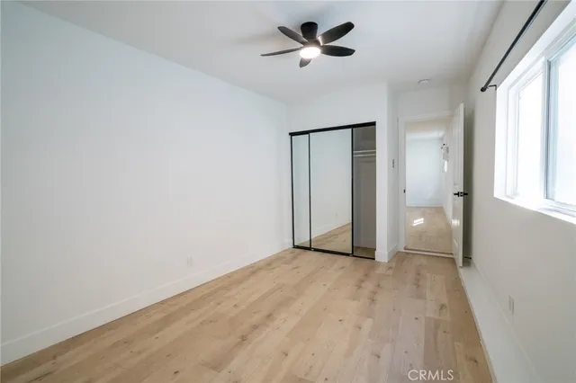a bathroom with a bathtub shower sink vanity and toilet
