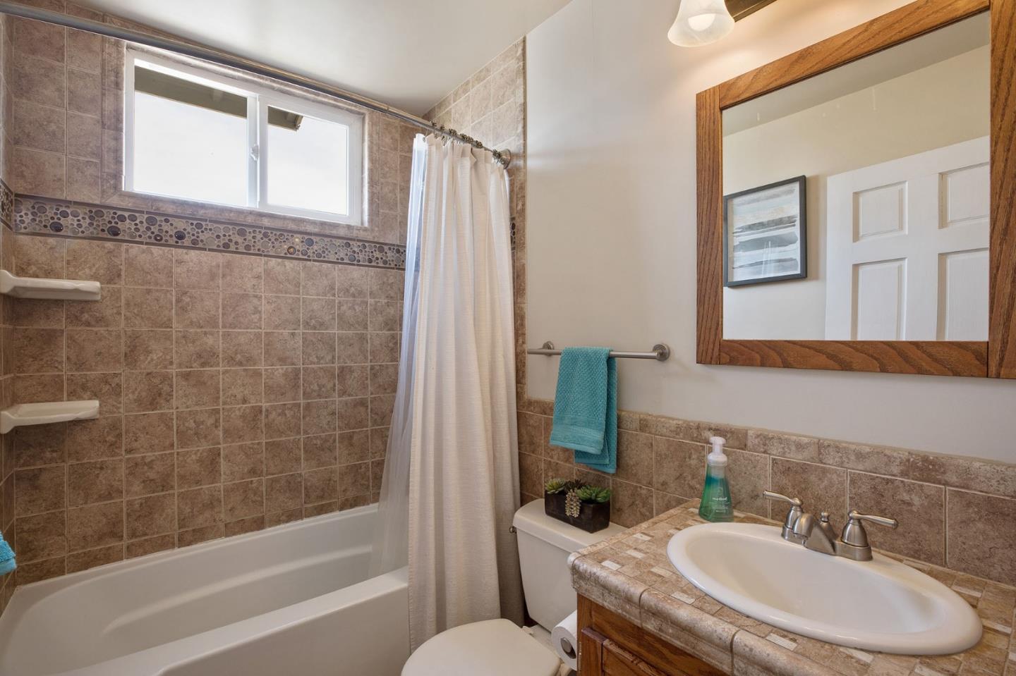 644 Foothill Drive Pacifica, CA 94044 - Photo 13 of 15 a bathroom with a sink toilet and shower
