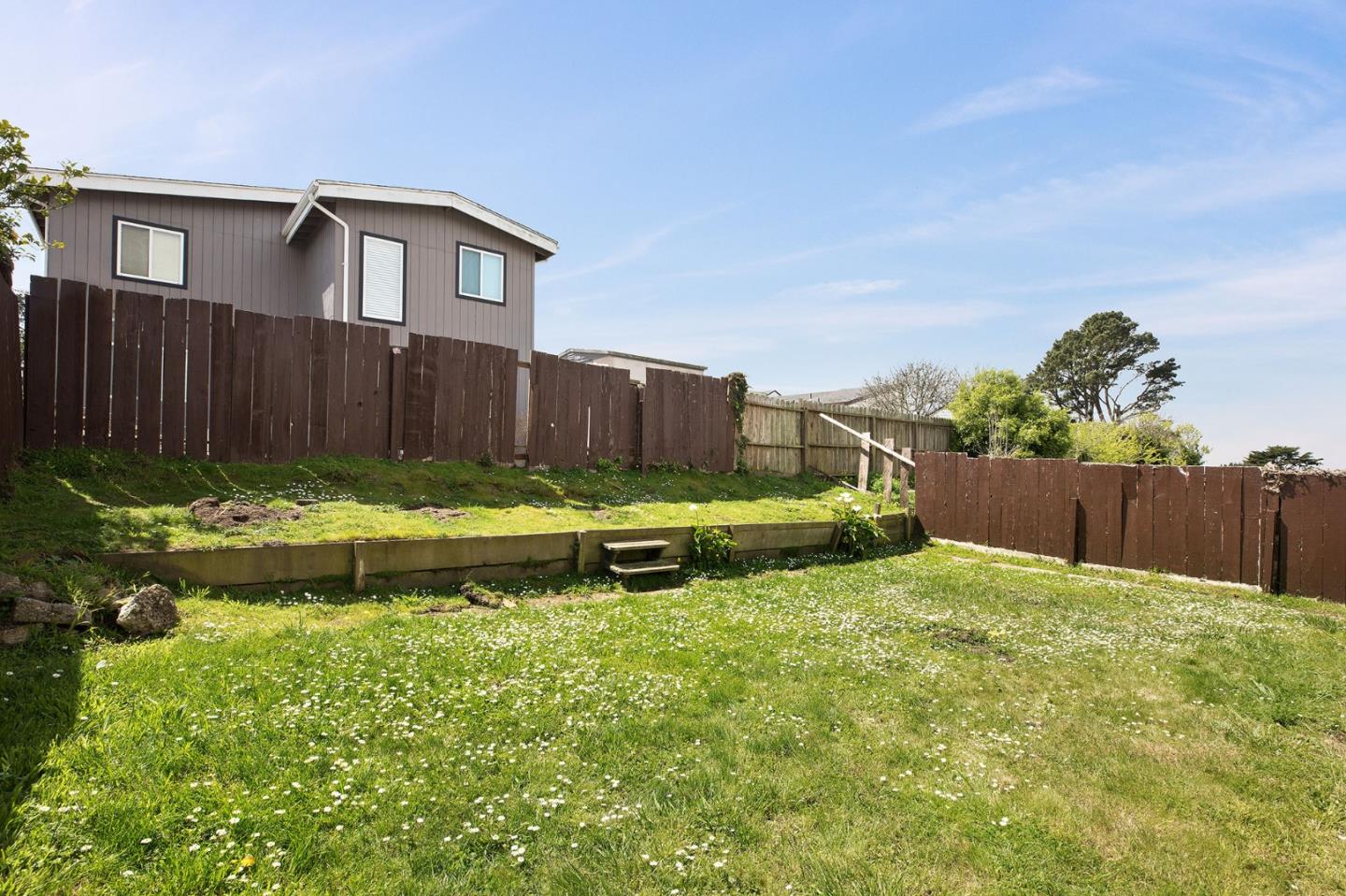 644 Foothill Drive Pacifica, CA 94044 - Photo 14 of 15 a view of a yard with wooden fence