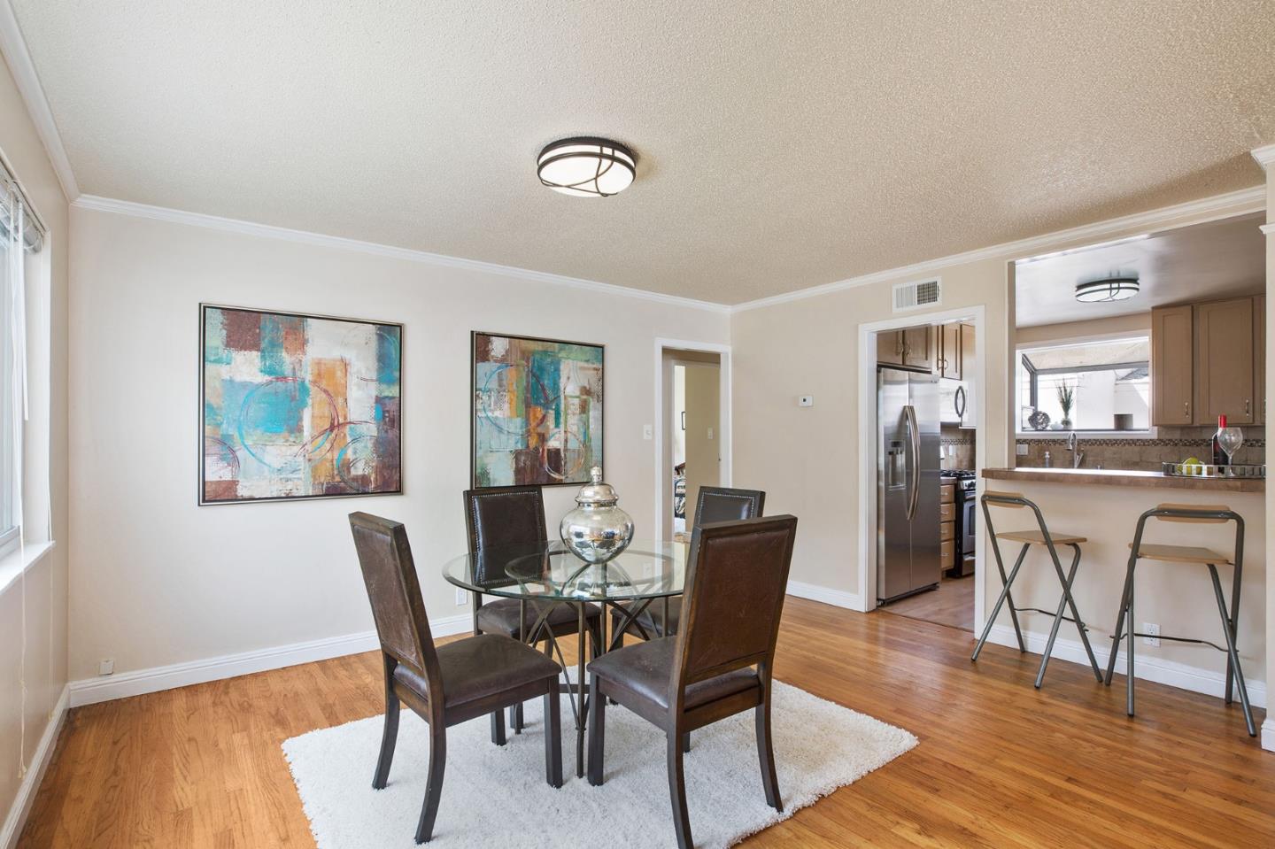 644 Foothill Drive Pacifica, CA 94044 - Photo 4 of 15 a view of a dining room with furniture and wooden floor