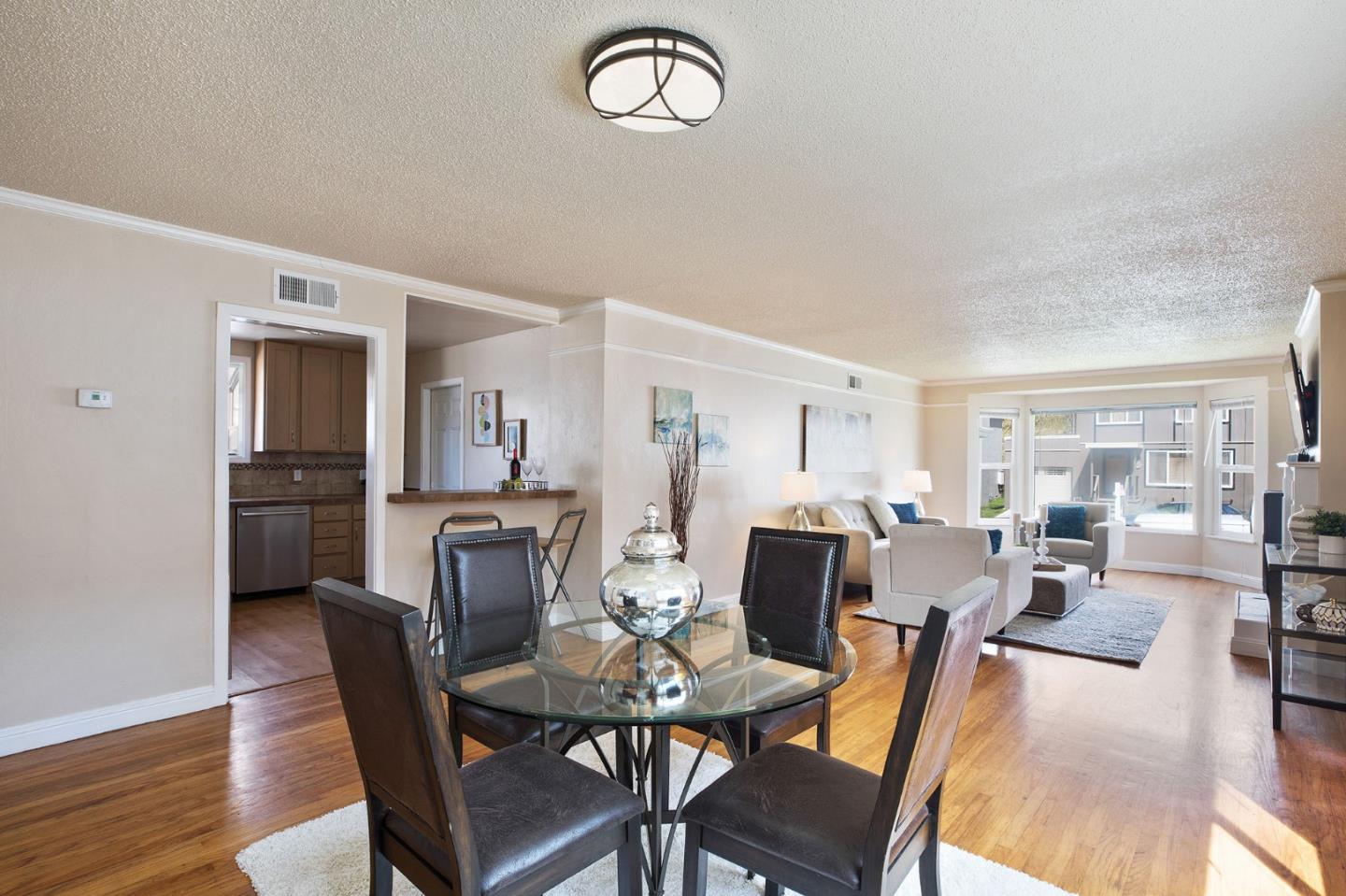 644 Foothill Drive Pacifica, CA 94044 - Photo 5 of 15 a view of a dining room with furniture window and wooden floor