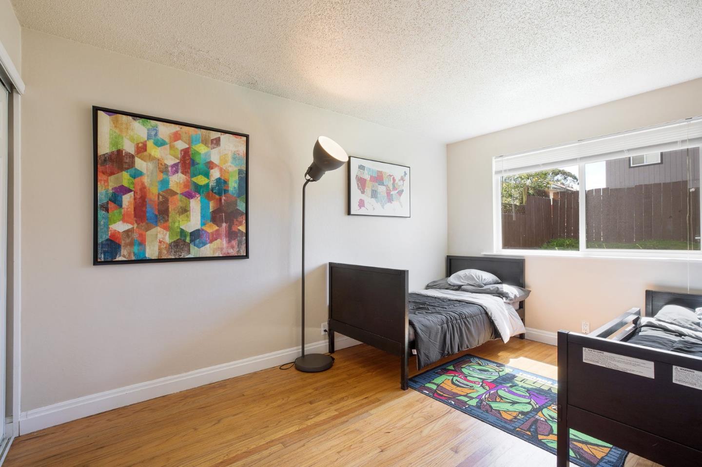 644 Foothill Drive Pacifica, CA 94044 - Photo 10 of 15 a bedroom with furniture and a large window