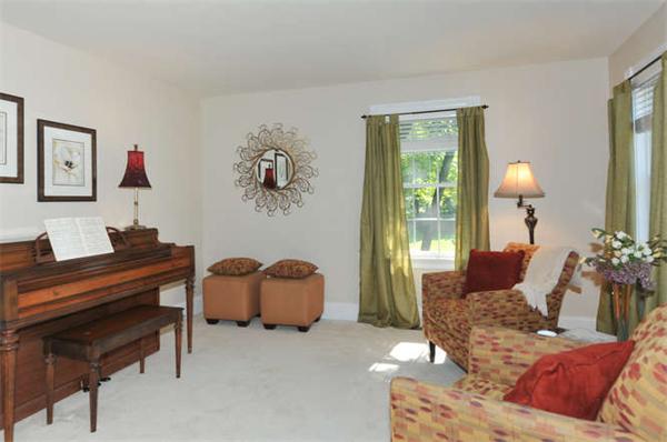 10 Oregon Road Ashland, MA 01721 - Photo 13 of 28 a living room with furniture and a piano