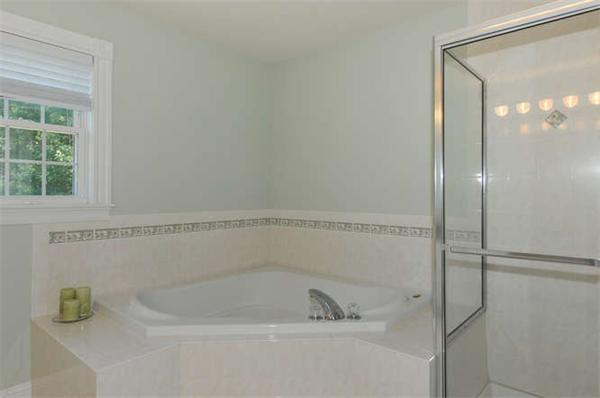 10 Oregon Road Ashland, MA 01721 - Photo 17 of 28 a bathroom with a shower and a bathtub
