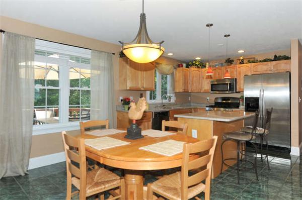 10 Oregon Road Ashland, MA 01721 - Photo 2 of 28 a kitchen with a table and chairs in it