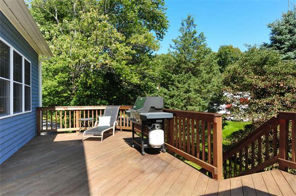 10 Oregon Road Ashland, MA 01721 - Photo 25 of 28 a view of a deck with two chairs and a large tree