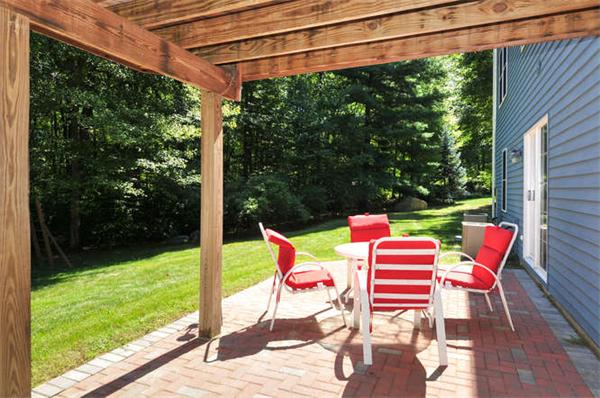 10 Oregon Road Ashland, MA 01721 - Photo 26 of 28 a chair and table in the garden