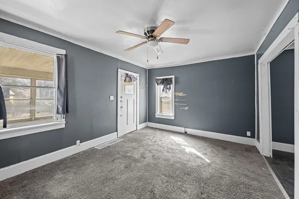 a view of an empty room with a window