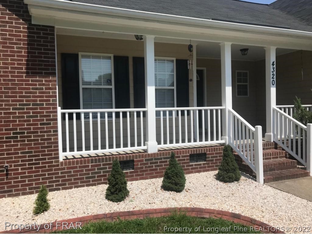 4320 Rocinta Court Hope Mills, NC 28348 - Photo 2 of 2 a view of porch with a bench