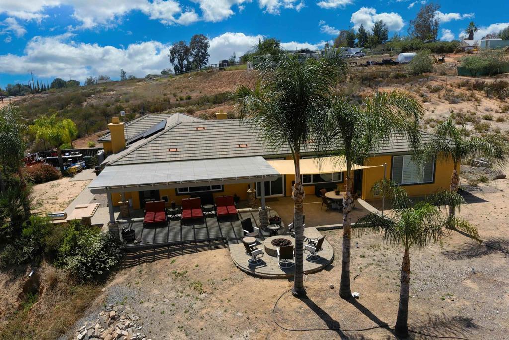 22963 Stokes Road Ramona, CA 92065 - Photo 47 of 57 an outdoor space with seating area and trees around