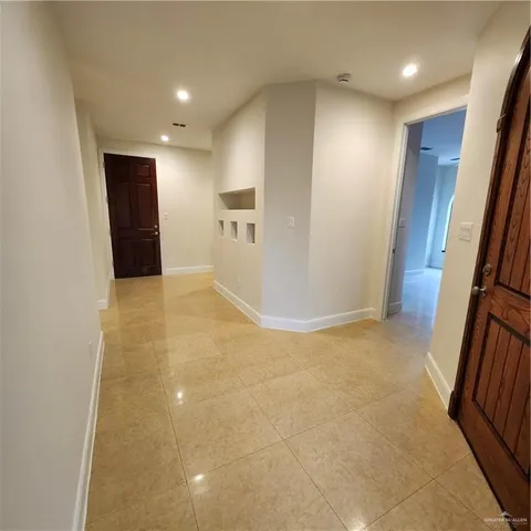 a view of a kitchen with a sink a counter top space and cabinets