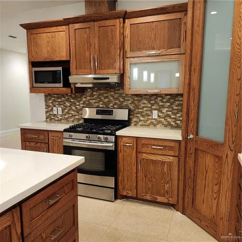 a view of walk in closet with wooden floor
