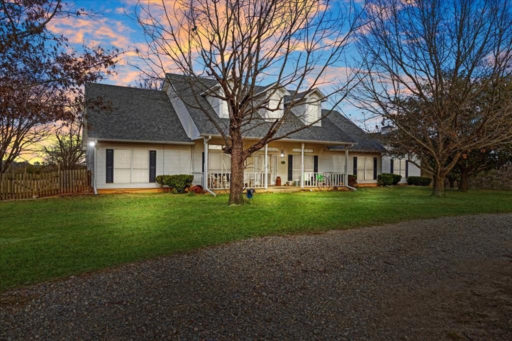1044 County Road 3230 Windom, TX 75492 - Photo 2 of 40 a front view of a house with a yard