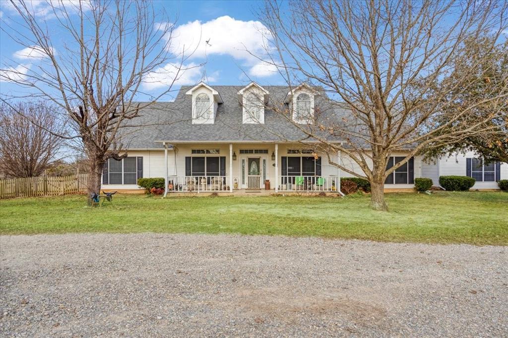 1044 County Road 3230 Windom, TX 75492 - Photo 3 of 40 a view of a big house with a big yard and large trees