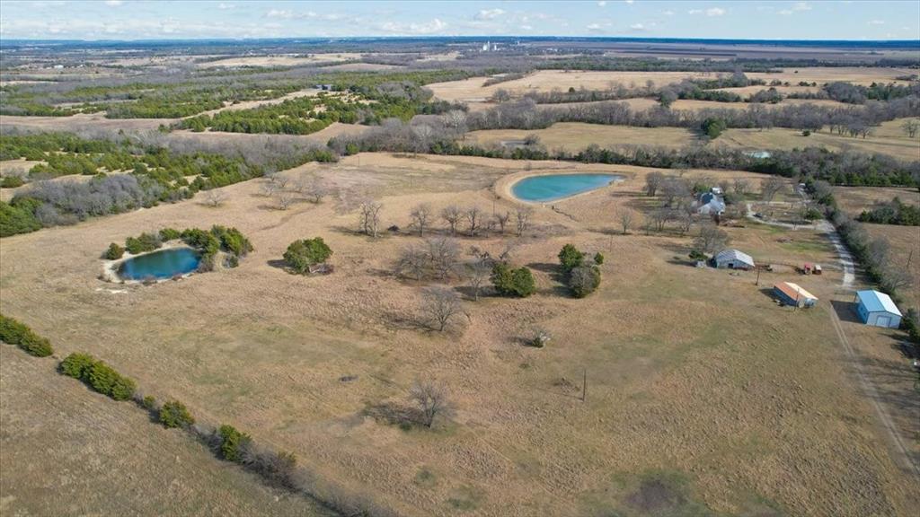 1044 County Road 3230 Windom, TX 75492 - Photo 33 of 40 a view of a dry yard with wooden fence