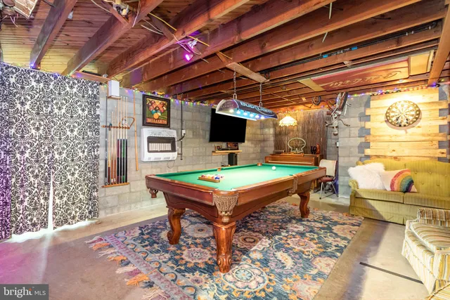 a room with furniture and flat screen tv