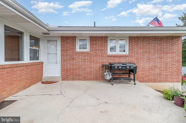 a backyard of a house with seating space
