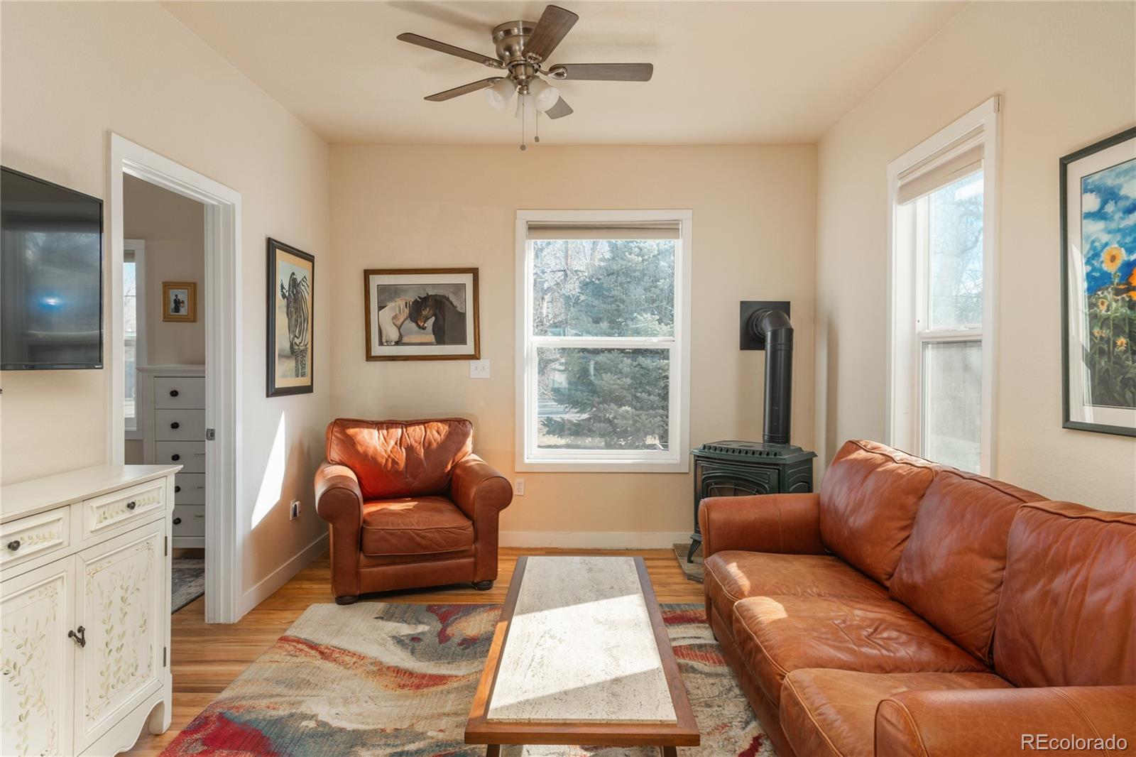 4695 Parfet Street Wheat Ridge, CO 80033 - Photo 18 of 46 a living room with furniture and a window