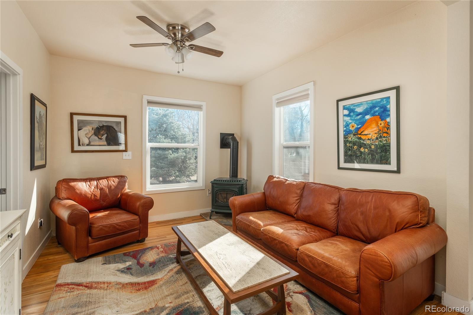 4695 Parfet Street Wheat Ridge, CO 80033 - Photo 19 of 46 a living room with furniture a couch and a window