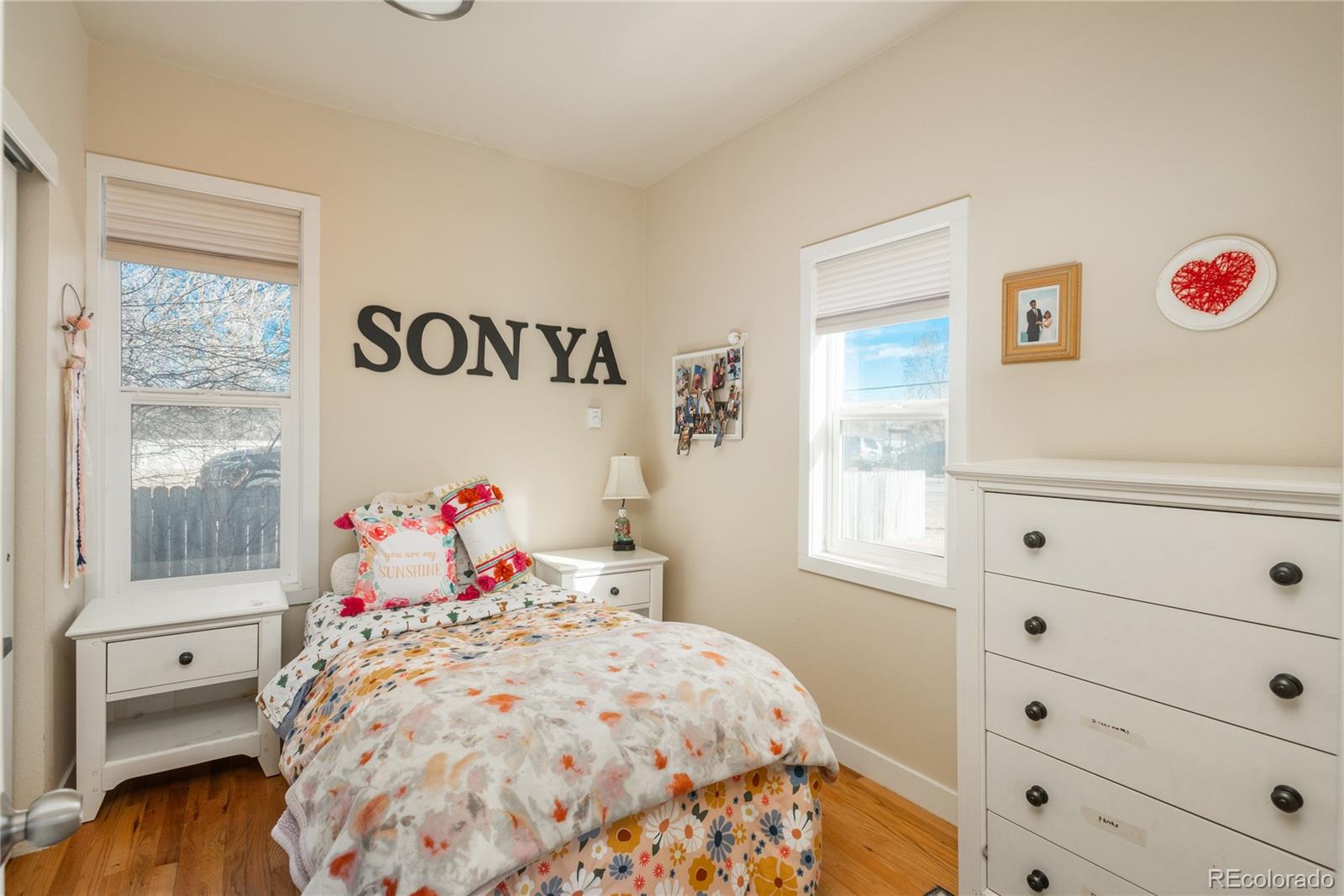 4695 Parfet Street Wheat Ridge, CO 80033 - Photo 20 of 46 a bedroom with a bed and a window