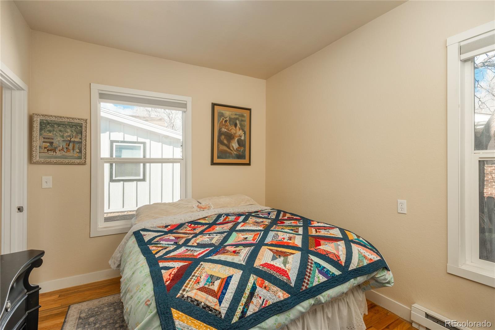 4695 Parfet Street Wheat Ridge, CO 80033 - Photo 27 of 46 a bedroom with a bed and a window