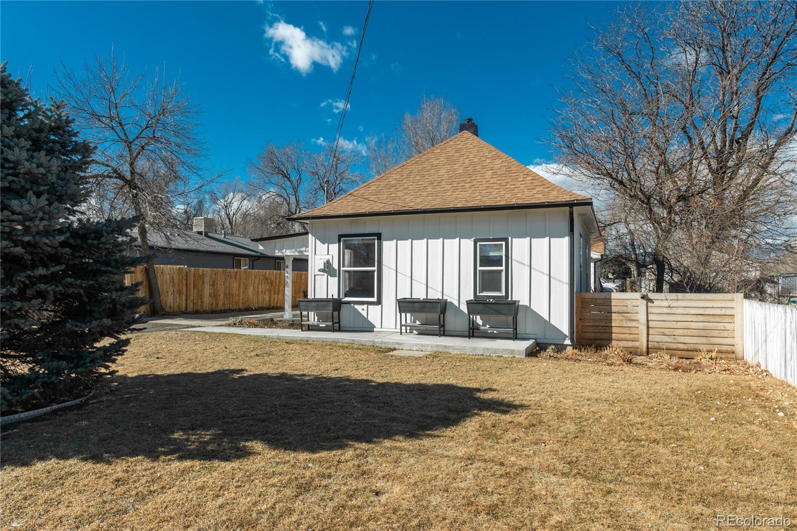 4695 Parfet Street Wheat Ridge, CO 80033 - Photo 3 of 46 a view of a house with backyard and sitting area