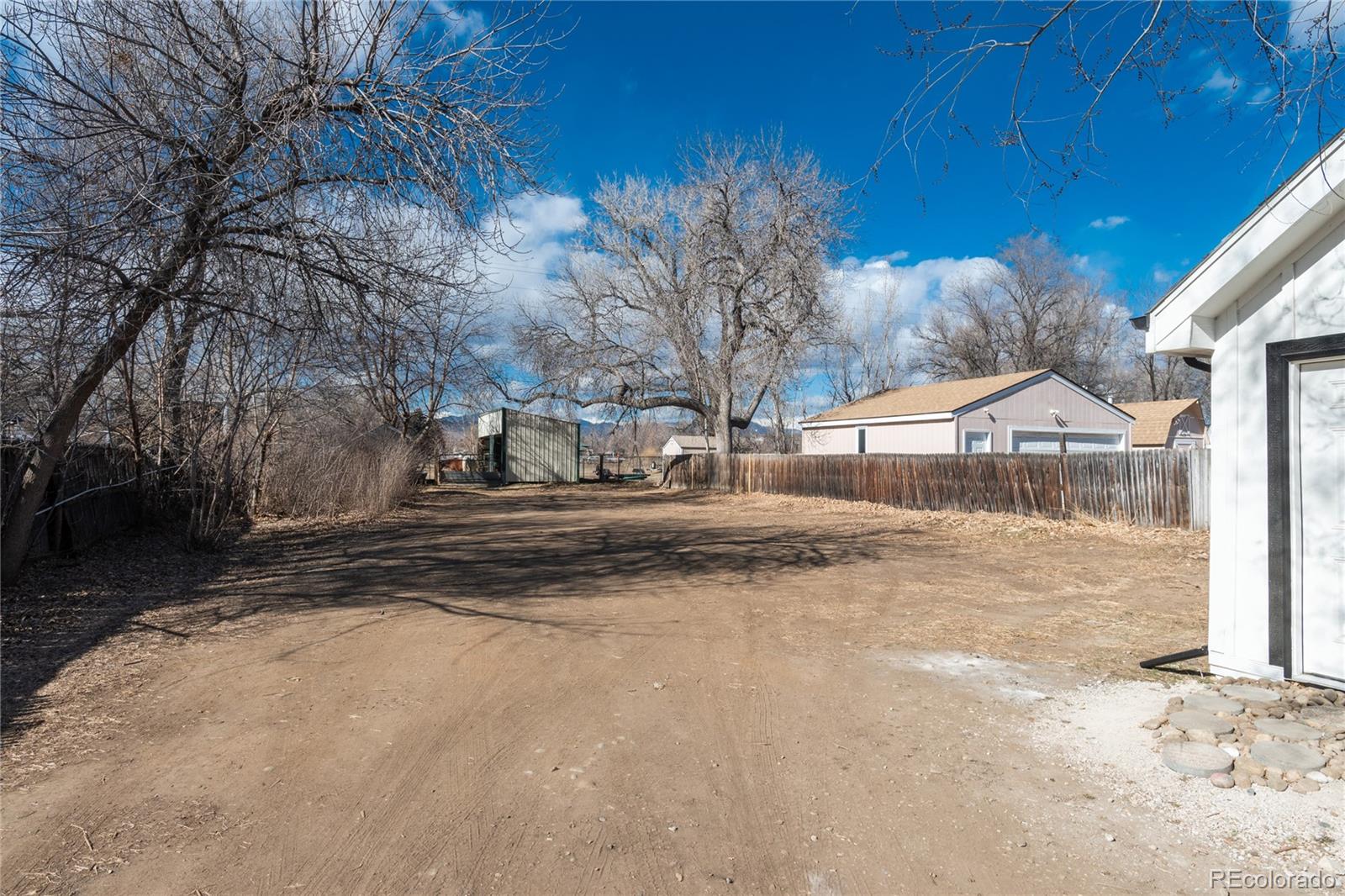 4695 Parfet Street Wheat Ridge, CO 80033 - Photo 37 of 46 a view of street with large trees