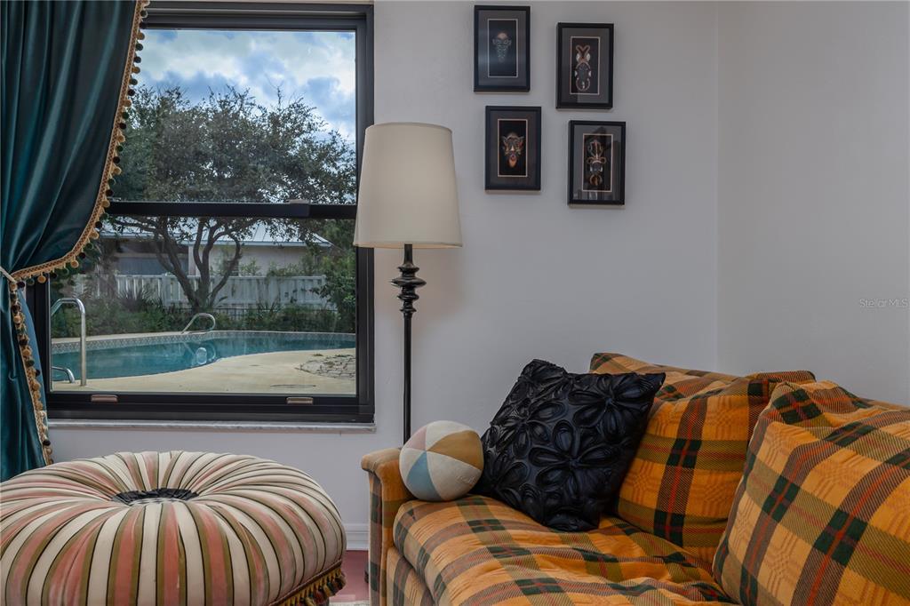 4790 Michael Lane Ponce Inlet, FL 32127 - Photo 15 of 28 a bedroom with a bed and window
