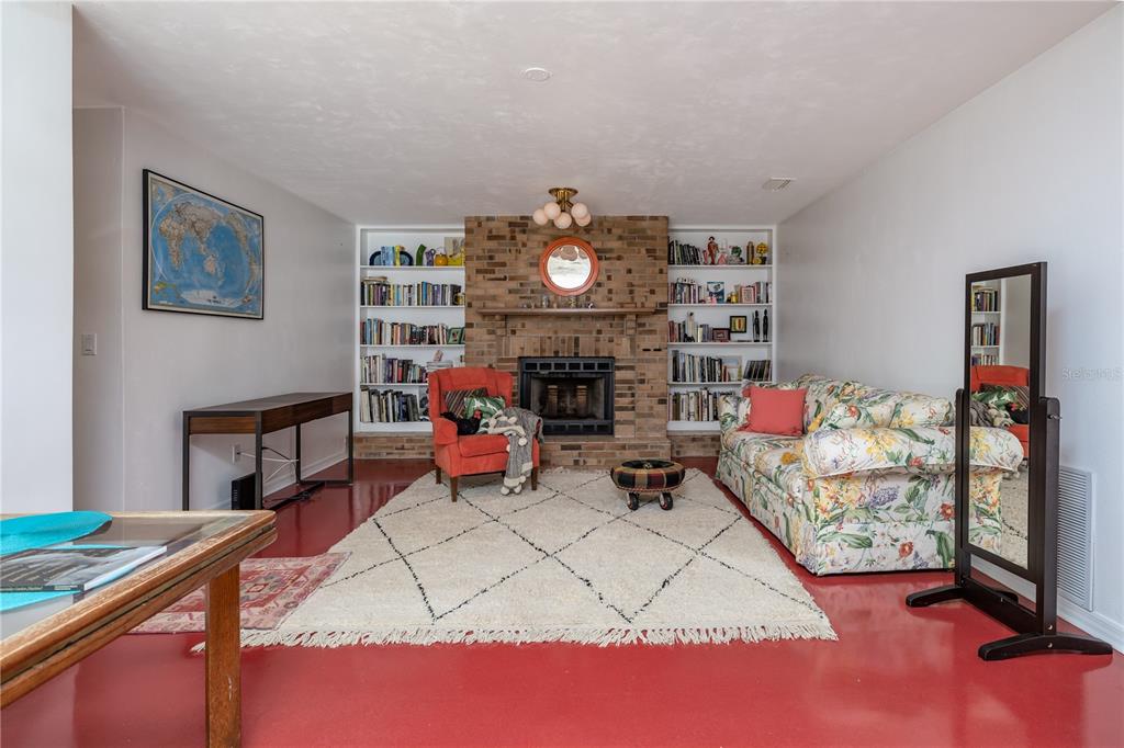 4790 Michael Lane Ponce Inlet, FL 32127 - Photo 16 of 28 a living room with furniture a rug and a lamp