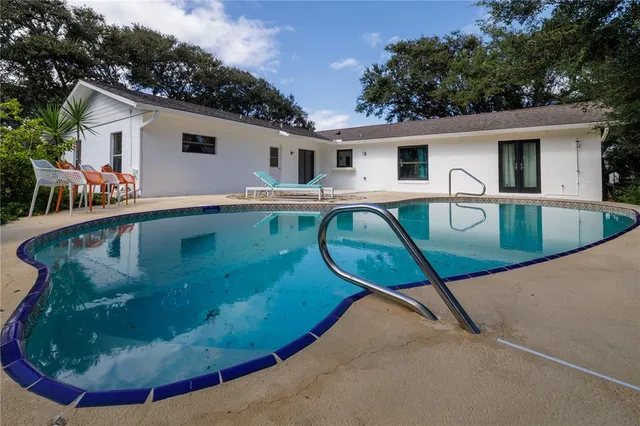 a view of a house with swimming pool