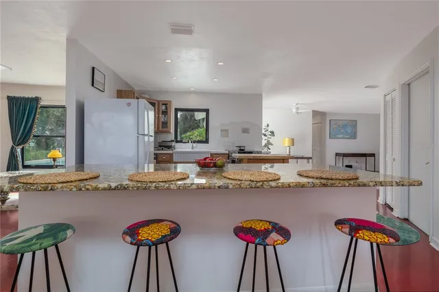 a kitchen with stainless steel appliances granite countertop a sink and cabinets