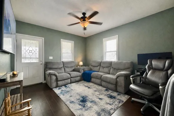 a living room with furniture and a window