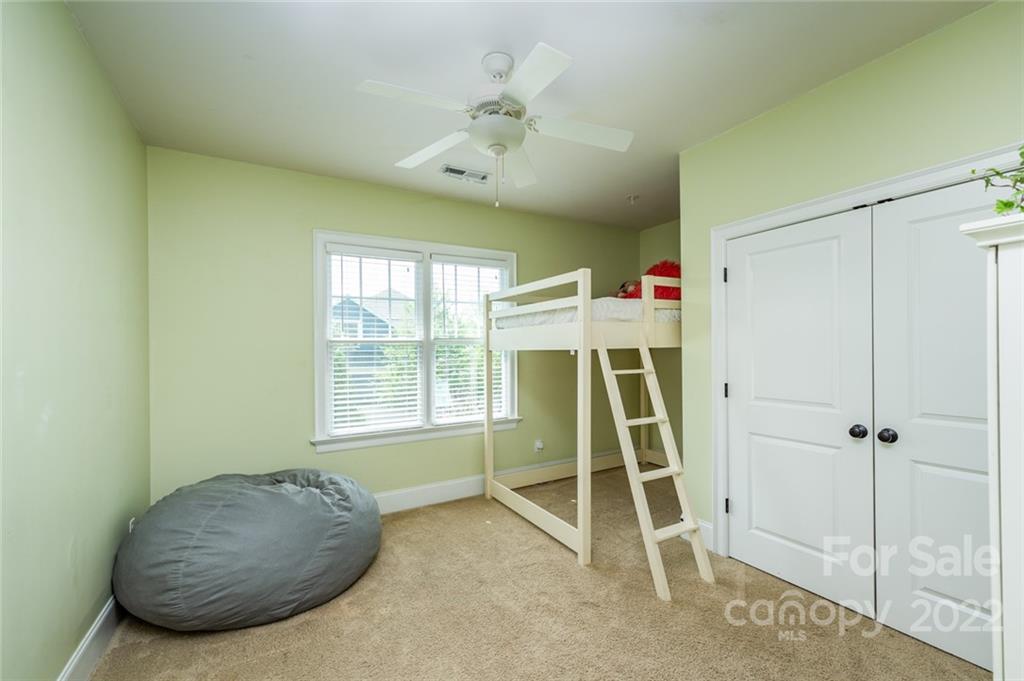 6009 Daphne Circle Fort Mill, SC 29708 - Photo 17 of 43 a room with a ceiling fan and a window