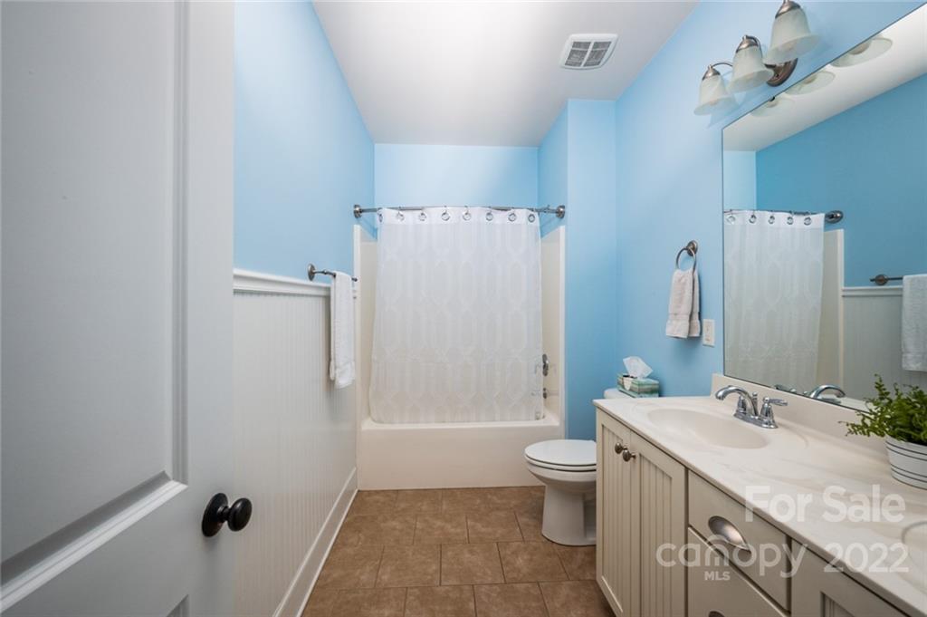 6009 Daphne Circle Fort Mill, SC 29708 - Photo 18 of 43 a bathroom with a granite countertop sink toilet and shower