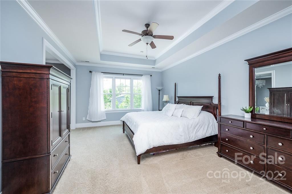 6009 Daphne Circle Fort Mill, SC 29708 - Photo 23 of 43 a bedroom with a bed dresser and a window