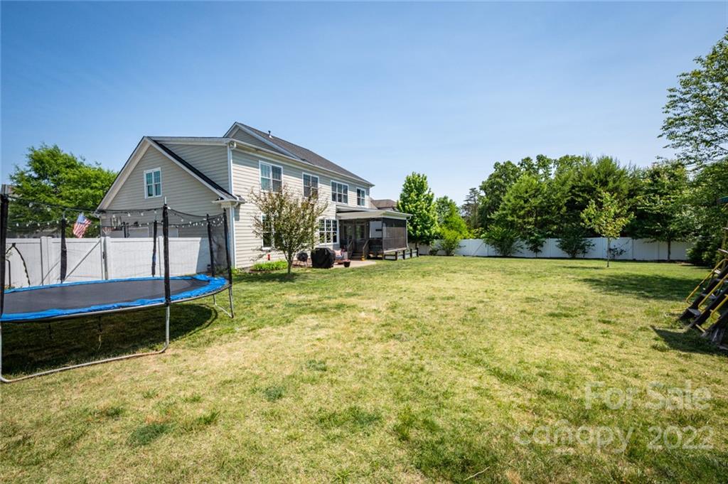 6009 Daphne Circle Fort Mill, SC 29708 - Photo 34 of 43 a view of a house with a yard and sitting area