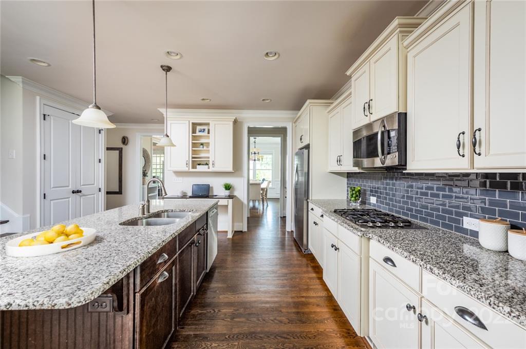 6009 Daphne Circle Fort Mill, SC 29708 - Photo 7 of 43 a kitchen with stainless steel appliances granite countertop a stove a sink dishwasher and a refrigerator