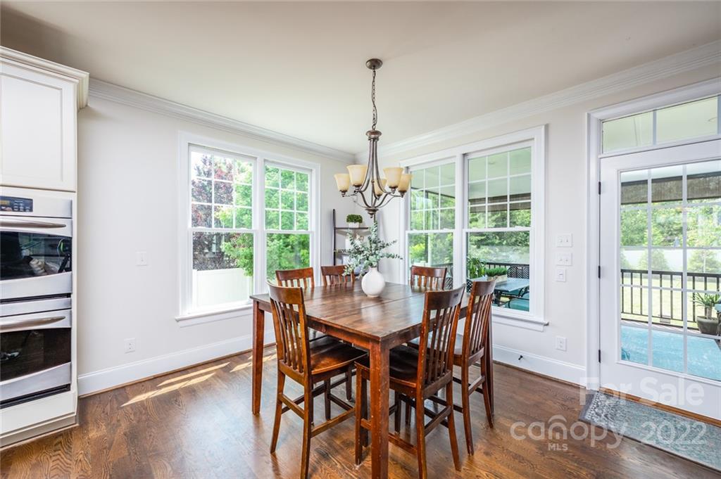 6009 Daphne Circle Fort Mill, SC 29708 - Photo 10 of 43 a view of a dining room with furniture window and wooden floor