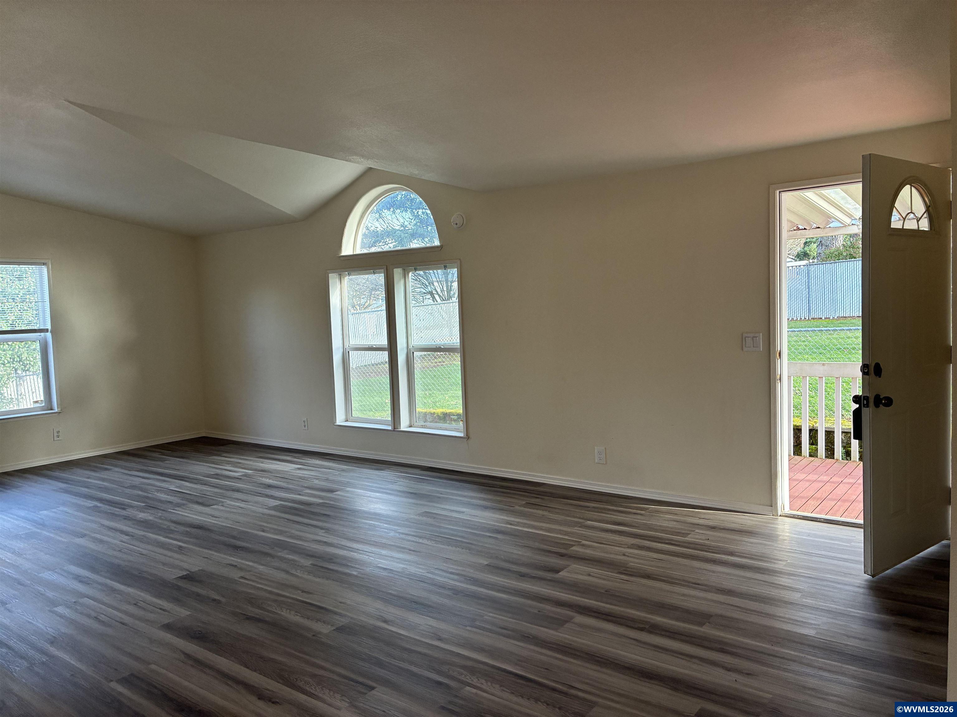 2000 Robins Lane Southeast, Unit 7 Salem, OR 97306 - Photo 3 of 39 an empty room with wooden floor and a window