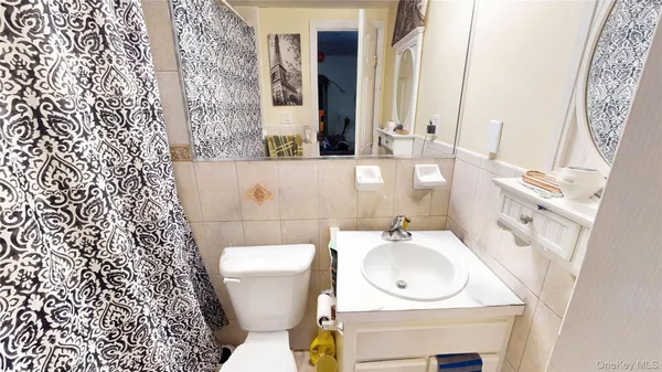 a kitchen with stainless steel appliances granite countertop a refrigerator a stove and a sink with cabinets