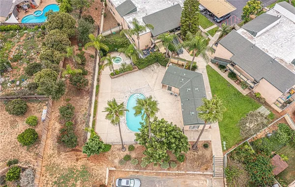 an aerial view of a house with a yard