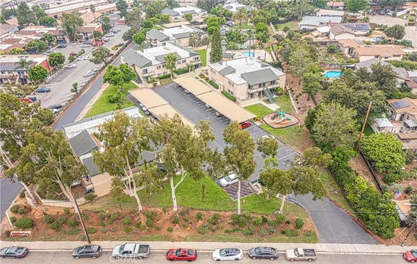 an aerial view of residential houses with outdoor space