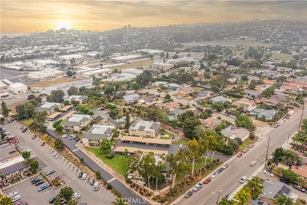 an aerial view of residential houses with outdoor space