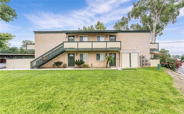 a utility room with cabinets washer and dryer