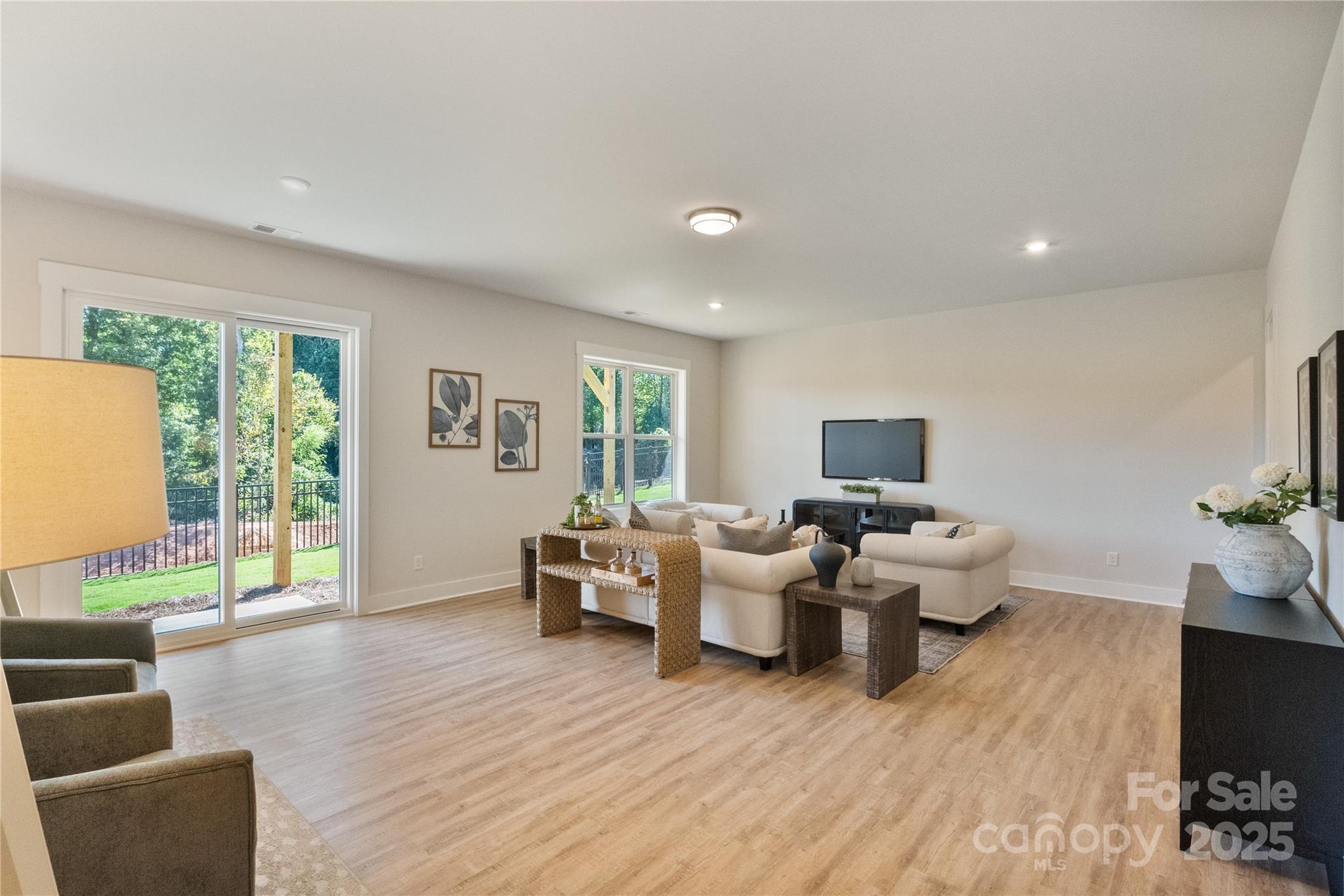 2081 Bonds Lane, Unit 27 Fort Mill, SC 29715 - Photo 38 of 46 a living room with furniture and wooden floor