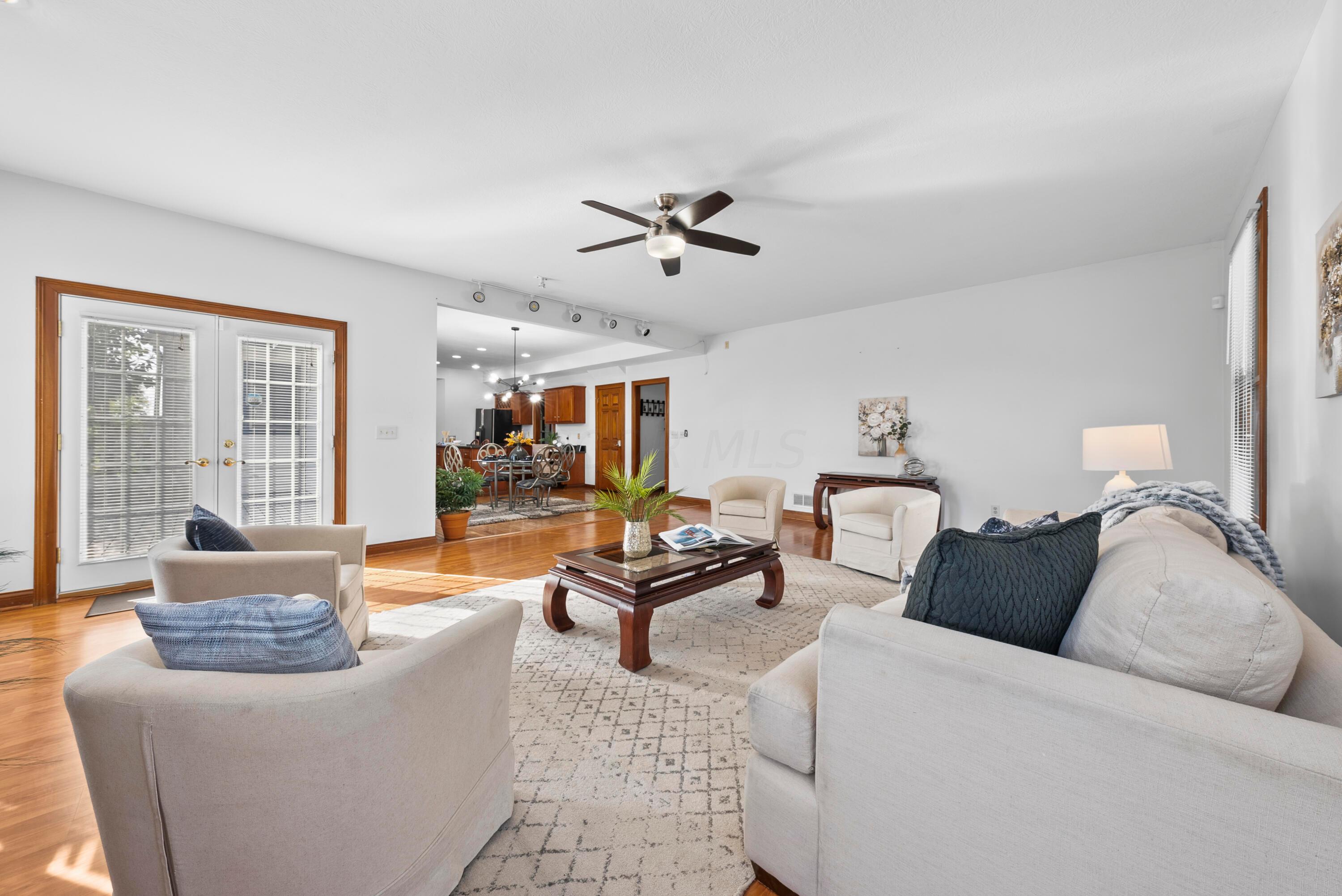 Great room with French doors to deck & backyard